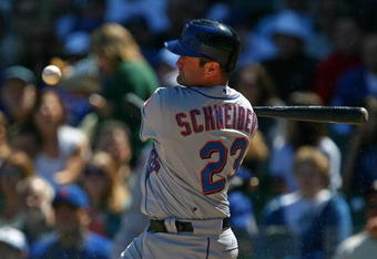 CHICAGO - AUGUST 30: Brain Schneider #23 of the New York Mets looks at the ball after fouling off a pitch against the Chicago Cubs on August 30, 2009 at Wrigley Field in Chicago, Illinois. The Mets defeated the Cubs 4-1. (Photo by Jonathan Daniel/Getty Images)