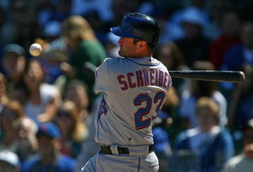 CHICAGO - AUGUST 30: Brain Schneider #23 of the New York Mets looks at the ball after fouling off a pitch against the Chicago Cubs on August 30, 2009 at Wrigley Field in Chicago, Illinois. The Mets defeated the Cubs 4-1. (Photo by Jonathan Daniel/Getty Images)