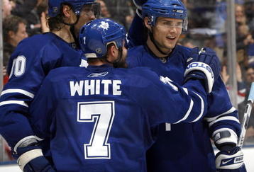 TORONTO - FEBRUARY 19: Nik Antropov #80, Ian White #7 and Alexei Ponikarovsky #23 of the Toronto Maple Leafs celebrate Nik Antropov's goal during game action February 19, 2009 at the Air Canada Centre in Toronto, Ontario, Canada. (Photo by Dave Abel/Getty Images)