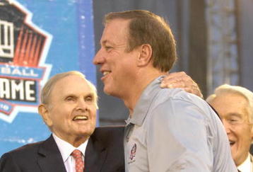 CANTON, OH - AUGUST 04:  Buffalo Bills owner Ralph Wilson (L) and retired quarterback Jim Kelly hug during the Class of 2007 Pro Football Hall of Fame Enshrinement Ceremony August 4, 2007 in Canton, Ohio. (Photo by Al Messerschmidt/Getty Images)