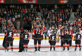 OTTAWA, ON - NOVEMBER 10:  During the Ottawa Senators 'Minor Hockey Week' minor hockey players lineup on the blueline along with NHL players such as Jarkko Ruutu #73 and Chris Campoli #14 during the National Anthem before a game against the Edmonton Oilers at Scotiabank Place on November 10, 2009 in Ottawa, Canada.  (Photo by Phillip MacCallum/Getty Images)