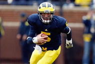 ANN ARBOR, MI - OCTOBER 24:  Tate Forcier #5 of the Michigan Wolverines carries the ball during the game against the Penn State Nittany Lions on October 24, 2009 at Michigan Stadium in Ann Arbor, Michigan. (Photo by  Gregory Shamus/Getty Images)