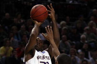 PORTLAND, OR - MARCH 19:  Quincy Pondexter #20 of the Washington Huskies shoots the ball over Ravern Johnson #2 of the Mississippi State Bulldogs during the first round of the NCAA Division I Men's Basketball Tournament at the Rose Garden on March 19, 2009 in Portland, Oregon.  (Photo by Jonathan Ferrey/Getty Images)