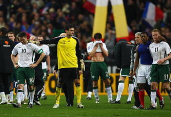 PARIS - FRANCE-NOVEMBER 18: Robbie Keane (L) of Ireland is consoled by Hugo lloris (2nd L) as Patrice Evra (2nd R) consoles Damien Duff (R) after the 1-1 draw which saw Ireland lose 2-1 on aggregate during the France v Republic of Ireland FIFA 2010 World Cup Qualifying Play Off second leg match at the Stade de France on November 18, 2009 in Paris, France.  (Photo by Michael Steele/Getty Images)