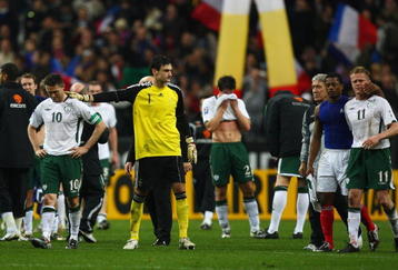 PARIS - FRANCE-NOVEMBER 18: Robbie Keane (L) of Ireland is consoled by Hugo lloris (2nd L) as Patrice Evra (2nd R) consoles Damien Duff (R) after the 1-1 draw which saw Ireland lose 2-1 on aggregate during the France v Republic of Ireland FIFA 2010 World Cup Qualifying Play Off second leg match at the Stade de France on November 18, 2009 in Paris, France.  (Photo by Michael Steele/Getty Images)
