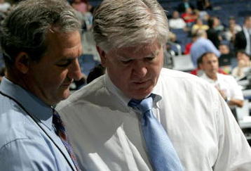 COLUMBUS, OH - JUNE 22:  General Manager Brian Burke (R) of the Anaheim Ducks speaks to General Manager Darryl Sutter of the Calgary Flames during the first round of the 2007 NHL Entry Draft at Nationwide Arena on June 22, 2007 in Columbus, Ohio.  (Photo by Bruce Bennett/Getty Images)