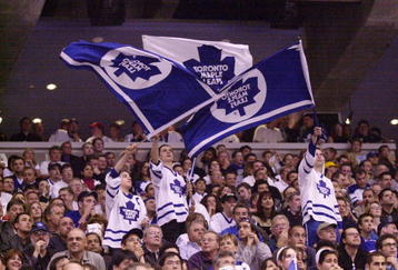 7 May 2001: Toronto Maple Leafs fans waves flags during game 6 of the Eastern Conference Semifinals against the New Jersey Devils at the Air Canada Center in Toronto, Ontario, Canada.  The Devils won 4-2. DIGITAL IMAGE.  Mandatory Credit: Harry How/ALLSPORT