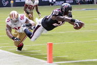HOUSTON - OCTOBER 25:  Running back Steve Slaton #20 of the Houston Texans avoids a tackle by defensive tackle Isaac Sopoaga #90 of the San Francisco 49ers as he dives for the goaline for a touchdown at Reliant Stadium on October 25, 2009 in Houston, Texas.  (Photo by Bob Levey/Getty Images)
