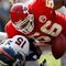 KANSAS CITY, MO - SEPTEMBER 28:  Derrick Johnson #56 of the Kansas City Chiefs strips the ball from Brandon Marshall #15 of the Denver Broncos causing a fumble during the first half of the game on September 28, 2008 at Arrowhead Stadium in Kansas City, Missouri.  (Photo by Jamie Squire/Getty Images)