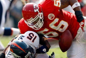 KANSAS CITY, MO - SEPTEMBER 28:  Derrick Johnson #56 of the Kansas City Chiefs strips the ball from Brandon Marshall #15 of the Denver Broncos causing a fumble during the first half of the game on September 28, 2008 at Arrowhead Stadium in Kansas City, Missouri.  (Photo by Jamie Squire/Getty Images)