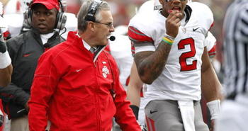 ANN ARBOR, MI - NOVEMBER 21: Head coach Jim Tressel of the Ohio State Buckeyes walks the sideline next to Terrelle Pryor #2 while playing the Michigan Wolverines on November 21, 2009 at Michigan Stadium in Ann Arbor, Michigan. Ohio State won the game 21-10. (Photo by Gregory Shamus/Getty Images)