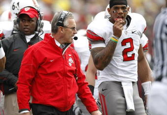 ANN ARBOR, MI - NOVEMBER 21: Head coach Jim Tressel of the Ohio State Buckeyes walks the sideline next to Terrelle Pryor #2 while playing the Michigan Wolverines on November 21, 2009 at Michigan Stadium in Ann Arbor, Michigan. Ohio State won the game 21-10. (Photo by Gregory Shamus/Getty Images)