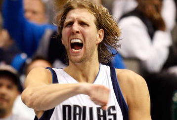 DALLAS - NOVEMBER 18:  Forward Dirk Nowitzki #41 of the Dallas Mavericks reacts after scoring in overtime against the San Antonio Spurs on November 18, 2009 at American Airlines Center in Dallas, Texas.  NOTE TO USER: User expressly acknowledges and agrees that, by downloading and/or using this Photograph, user is consenting to the terms and conditions of the Getty Images License Agreement.  (Photo by Ronald Martinez/Getty Images)
