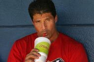 LONG BEACH, CA - JULY 16:  Jose Canseco #33 of the Long Beach Armada drinks a juice drink while resting in between Golden Baseball League games against the Fullerton Flyers on July 16, 2006 at Blair Field in Long Beach, California.  (Photo By Christian Petersen/Getty Images)