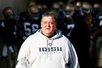 SOUTH BEND, IN - NOVEMBER 21: Head coach Charlie Weis of the Notre Dame Fighting Irish walks out of the tunnel before lining up to enter the field for a game against the Univeristy of Connecticut Huskies at Notre Dame Stadium on November 21, 2009 in South Bend, Indiana. (Photo by Jonathan Daniel/Getty Images)