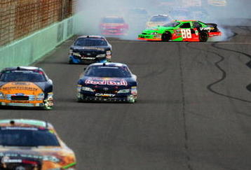 HOMESTEAD, FL - NOVEMBER 21:  (R) Brad Keselowski, driver of the #88 GoDaddy Chevrolet, spins out of control during the NASCAR Nationwide Series Ford 300 at Homestead-Miami Speedway on November 21, 2009 in Homestead, Florida.  (Photo by Todd Warshaw/Getty Images)