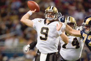 ST. LOUIS - NOVEMBER 15:  Quarterback Drew Brees #9 of the New Orleans Saints passes the ball during the game against the St. Louis Rams at the Edward Jones Dome on November 15, 2009 in St. Louis, Missouri.  (Photo by Dilip Vishwanat/Getty Images)