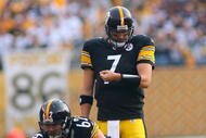 PITTSBURGH - NOVEMBER 15:  Quarterback Ben Roethlisberger #7 of the Pittsburgh Steelers looks at his wrist band for a play prior to the snap of the ball behind center during their game against the Cincinnati Bengals at Heinz Field on November 15, 2009 in Pittsburgh, Pennsylvania. The Bengals defeated the Steelers 18-12. (Photo by Rick Stewart/Getty Images)