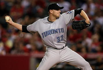 ANAHEIM, CA - MAY 6:  Roy Halladay #32 of the Toronto Blue Jays throws a pitch against the Los Angeles Angels of Anaheim at Angel Stadium May 6, 2009 in Anaheim, California.  (Photo by Stephen Dunn/Getty Images)
