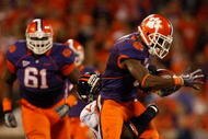 CLEMSON, SC - NOVEMBER 21:  The Virginia Cavaliers try to stop Jacoby Ford #6 of the Clemson Tigers during their game at Memorial Stadium on November 21, 2009 in Clemson, South Carolina.  (Photo by Streeter Lecka/Getty Images)