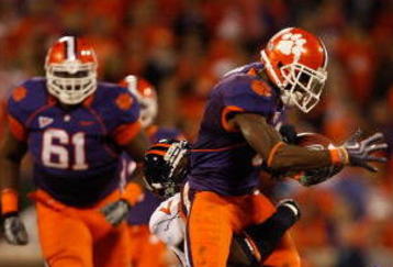 CLEMSON, SC - NOVEMBER 21:  The Virginia Cavaliers try to stop Jacoby Ford #6 of the Clemson Tigers during their game at Memorial Stadium on November 21, 2009 in Clemson, South Carolina.  (Photo by Streeter Lecka/Getty Images)