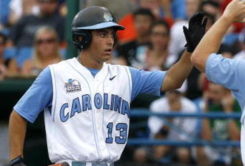 OMAHA, NE - JUNE 21:  First baseman Dustin Ackley #13 of the North Carolina Tar Heels celebrates with teammates after hitting a solo homer in the second inning to the give the Tar Heels a 1-0 lead over the Rice Owls in Game 13 of the NCAA College World Series at Rosenblatt Stadium on June 21, 2007 in Omaha, Nebraska. (Photo by Kevin C. Cox/Getty Images) 
