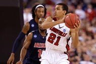 INDIANAPOLIS - MARCH 27:  Jared Swopshire #21 of the Louisville Cardinals looks to pass the ball against the Arizona Wildcats during the third round of the NCAA Division I Men's Basketball Tournament at the Lucas Oil Stadium on March 27, 2009 in Indianapolis, Indiana. Louisville won 103-64. (Photo by Andy Lyons/Getty Images)