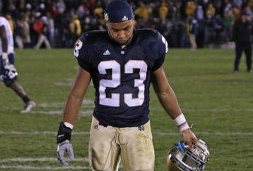SOUTH BEND, IN - NOVEMBER 21: Golden Tate #23 of the Notre Dame Fighting Irish walks off the field after a loss to the Univeristy of Connecticut Huskies at Notre Dame Stadium on November 21, 2009 in South Bend, Indiana. Connecticut defeated Notre Dame 33-30 in overtime. (Photo by Jonathan Daniel/Getty Images)