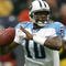 HOUSTON - DECEMBER 10:  Quarterback Vince Young #10 of the Tennessee Titans rolls out with the ball against the Houston Texans on December 10, 2006 at Reliant Stadium in Houston, Texas.  (Photo by Stephen Dunn/Getty Images)