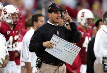 PALO ALTO, CA - NOVEMBER 07:  Stanford Cardinal head coach Jim Harbaugh listens to his headset during their game against the Oregon Ducks at Stanford Stadium on November 7, 2009 in Palo Alto, California.  (Photo by Ezra Shaw/Getty Images)