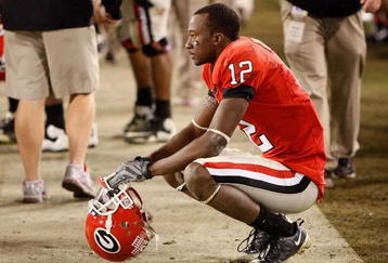 ATHENS, GA - NOVEMBER 21:  Tavarres King #12 of the Georgia Bulldogs squats dejected on the sideline after an interception by the Kentucky Wildcats in the final minutes of their 34-27 loss at Sanford Stadium on November 21, 2009 in Athens, Georgia.  (Photo by Kevin C. Cox/Getty Images)
