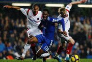 LONDON, ENGLAND - NOVEMBER 21:  John Mikel Obi of Chelsea is challenged by Karl Henry and Andrew Keogh of Wolverhampton Wanderers during the Barclays Premiership match between Chelsea and Wolverhampton Wanderers at Stamford Bridge on November 21, 2009 in London, England.  (Photo by Paul Gilham/Getty Images)