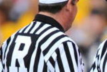 COLUMBUS, OH - NOVEMBER 14:  Head coach Kirk Ferentz of the Iowa Hawkeyes talks with the referee during a game against the Ohio State Buckeyes at Ohio Stadium on November 14, 2009 in Columbus, Ohio.  (Photo by Jamie Sabau/Getty Images)