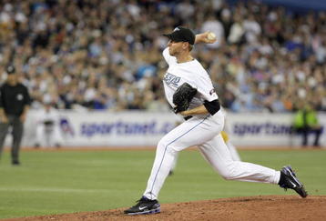 TORONTO - APRIL 6:  Roy Halladay #32 of the Toronto Blue Jays delivers the pitch during the Opening Day game against the Detroit Tigers at the Rogers Centre on April 6, 2009 in Toronto, Ontario. (Photo by: Dave Sandford/Getty Images)