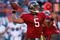 MIAMI GARDENS, FL - NOVEMBER 15:  Quarterback Josh Freeman #5 of the Tampa Bay Buccaneers throws a pass against the Miami Dolphins at Land Shark Stadium on November 15, 2009 in Miami Gardens, Florida. The Dolphins defeated the Buccaneers 25-23.  (Photo by Doug Benc/Getty Images)
