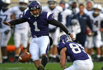 EVANSTON, IL - OCTOBER 31: Stefan Demos #1 of the Northwestern Wildcats kicks a field goal out of the hold of Zeke Markshausen #85 against the Penn State Nittany Lions at Ryan Field on October 31, 2009 in Evanston, Illinois. Penn State defeated Northwestern 34-13. (Photo by Jonathan Daniel/Getty Images)