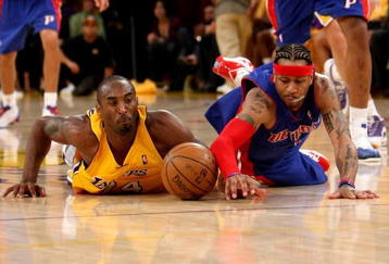LOS ANGELES, CA - NOVEMBER 14: Kobe Bryant #24 of the Los Angeles Lakers and Allen Iverson #1 of the Detroit Pistons dive for a loose ball on November 14, 2008 at Staples Center in Los Angeles, California. The Pistons won 106-95.   NOTE TO USER: User expressly acknowledges and agrees that, by downloading and/or using this Photograph, user is consenting to the terms and conditions of the Getty Images License Agreement.  (Photo by Stephen Dunn/Getty Images)