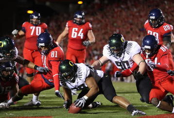 TUCSON, AZ - NOVEMBER 21:  Defensive end Will Tukuafu #39 of the Oregon Ducks recovers a fumble from David Roberts #81 of the Arizona Wildcats in the endzone during the college football game at Arizona Stadium on November 21, 2009 in Tucson, Arizona. The Ducks defeated the Wildcats 44-41 in second overtime. (Photo by Christian Petersen/Getty Images)