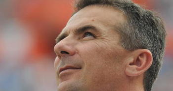 GAINESVILLE, FL - NOVEMBER 21: Coach Urban Meyer of the Florida Gators checks the scoreboard against the Florida International University Golden Panthers, November 21, 2009 at Ben Hill Griffin Stadium in Gainesville, Florida.  Florida won 62 - 3. (Photo by Al Messerschmidt/Getty Images)