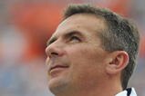 GAINESVILLE, FL - NOVEMBER 21: Coach Urban Meyer of the Florida Gators checks the scoreboard against the Florida International University Golden Panthers, November 21, 2009 at Ben Hill Griffin Stadium in Gainesville, Florida.  Florida won 62 - 3. (Photo by Al Messerschmidt/Getty Images)