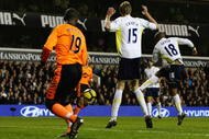 LONDON, ENGLAND - NOVEMBER 22:  Jermain Defoe of Tottenham Hotspur scores his third goal during the Barclays Premier League match between Tottenham Hotspur and Wigan Athletic at White Hart Lane on November 22, 2009 in London, England.  (Photo by Clive Rose/Getty Images)