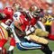 SAN FRANCISCO - NOVEMBER 08:  Alex Smith #11 of the San Francisco 49ers is tackled by William Hayes #95 of the Tennessee Titans during an NFL game on November 8, 2009 at Candlestick Park in San Francisco, California.  (Photo by Jed Jacobsohn/Getty Images)