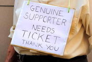 LONDON, ENGLAND - AUGUST 20:  Cricket fan Peter Wise wears a sign requesting a spare ticket from fans entering The Oval cricket ground on the first day of the fifth and final test match of the Ashes series on August 20, 2009 in London, England. England need a victory to reclaim the Ashes from Australia with the countries currently drawn on one a piece after the first four tests.  (Photo by Oli Scarff/Getty Images)