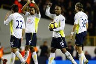LONDON, ENGLAND - NOVEMBER 22:  Jermain Defoe of Tottenham Hotspur collects the match ball after scoring five during the Barclays Premier League match between Tottenham Hotspur and Wigan Athletic at White Hart Lane on November 22, 2009 in London, England.  (Photo by Clive Rose/Getty Images)