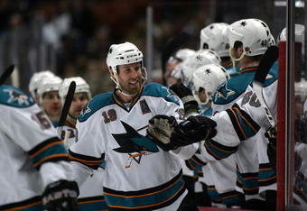 ANAHEIM, CA - NOVEMBER 21:  Joe Thornton #19 of the San Jose Sharks skates by the Sharks bench to celebrate with his teammates after scoring his third period eventual game-winning goal against the Anaheim Ducks during the NHL game at the Honda Center on November 21, 2009 in Anaheim, California. The Sharks defeated the Ducks 3-2.  (Photo by Victor Decolongon/Getty Images)