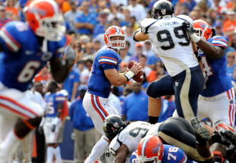 GAINESVILLE, FL - NOVEMBER 21: Quarterback Tim Tebow #15 of the Florida Gators sets to pass against the Florida International University Golden Panthers, November 21, 2009 at Ben Hill Griffin Stadium in Gainesville, Florida.  (Photo by Al Messerschmidt/Getty Images)