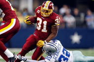 ARLINGTON, TX - NOVEMBER 22:  Running back Rock Cartwright #31 of the Washington Redskins runs the ball against Orlando Scandrick #32 of the Dallas Cowboys at Cowboys Stadium on November 22, 2009 in Arlington, Texas.  (Photo by Ronald Martinez/Getty Images)