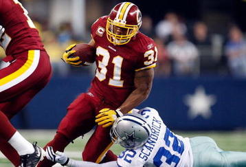 ARLINGTON, TX - NOVEMBER 22:  Running back Rock Cartwright #31 of the Washington Redskins runs the ball against Orlando Scandrick #32 of the Dallas Cowboys at Cowboys Stadium on November 22, 2009 in Arlington, Texas.  (Photo by Ronald Martinez/Getty Images)