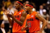 WINSTON-SALEM, NC - JANUARY 21:  Malcolm Delaney #23 and teammate Jeff Allen #0 of the Virginia Tech Hokies celebrate as they run to the bench against the Wake Forest Demon Deacons during their game at Lawrence Joel Coliseum on January 21, 2009 in Winston-Salem, North Carolina.  (Photo by Streeter Lecka/Getty Images)