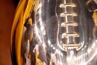 NEW ORLEANS - DECEMBER 21: Ronnie Thornton #56 of the Southern Mississippi Golden Eagles celebrates by kissing the trophy after defeating the Troy Trojans 30-27 in overtime to win the R+L Carriers New Orleans Bowl on December 21, 2008 at the Superdome in New Orleans, Louisiana. (Photo by Chris Graythen/Getty Images)